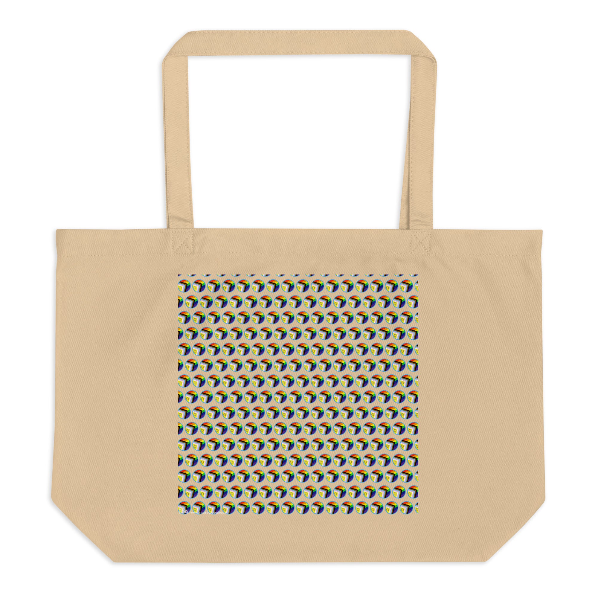 A beige canvas tote bag with a repeating geometric pattern of pride progress symbol  panel on the front, featuring blue, yellow, and green shapes on a black background.